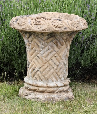 Lot 290 - A composite stone basket weave urn
