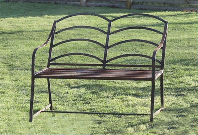 Lot 986 - An estate made wrought iron two-seater garden bench