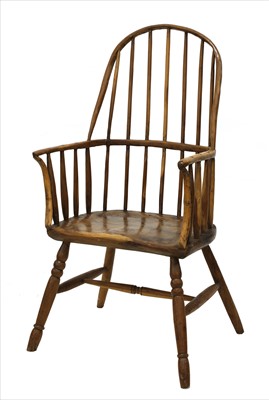 Lot 889 - A primitive yew stick back Windsor chair
