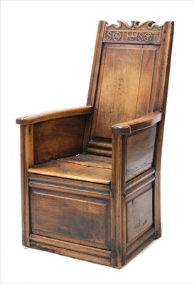 Lot 898 - A walnut lambing chair