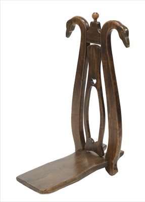 Lot 126 - An Italian walnut and stained pine boot jack