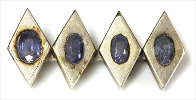 Lot 107 - A four stone sapphire bar brooch