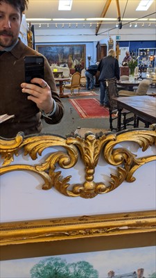 Lot 642 - A carved giltwood framed pier mirror