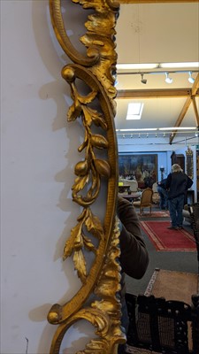 Lot 642 - A carved giltwood framed pier mirror