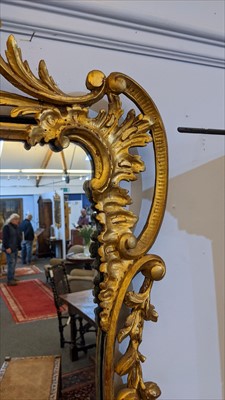 Lot 642 - A carved giltwood framed pier mirror