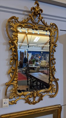 Lot 642 - A carved giltwood framed pier mirror