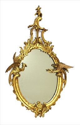 Lot 540 - A small carved giltwood framed oval mirror