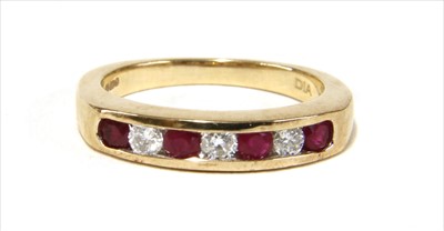 Lot 27 - A 9ct gold ruby and diamond half eternity ring