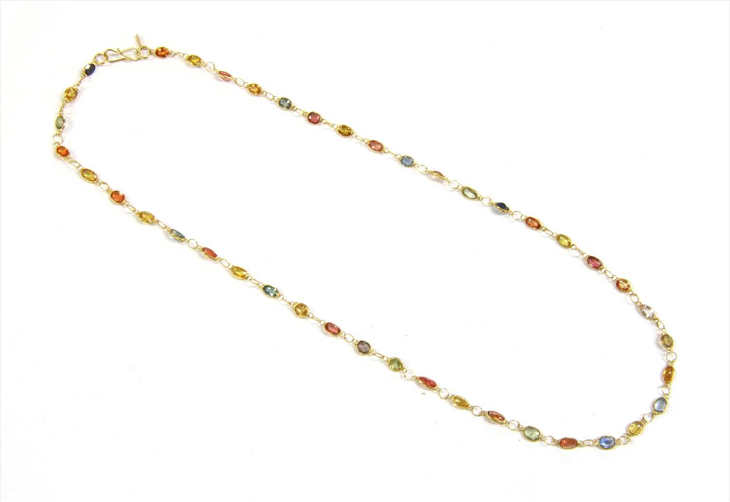 Lot 130 - A gold varicoloured sapphire rivière necklace