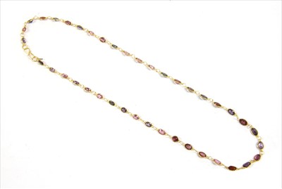Lot 102 - A gold varicoloured spinel rivière necklace