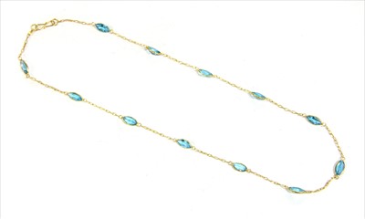 Lot 141 - A gold blue topaz rivière necklace
