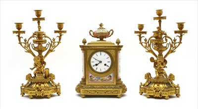 Lot 410 - A matched French gilt bronze clock garniture