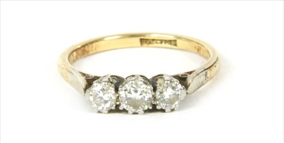 Lot 22 - A gold three stone diamond ring