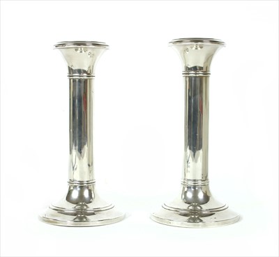 Lot 202 - A pair of silver candlesticks