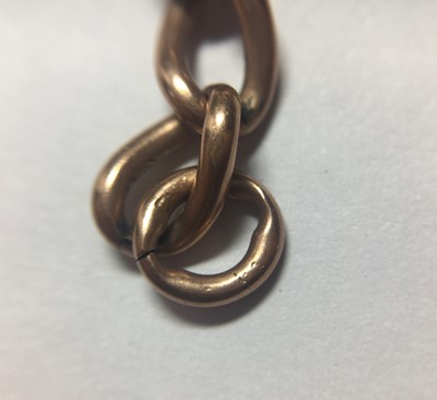 Lot 174 - A 9ct gold curb link double Albert chain