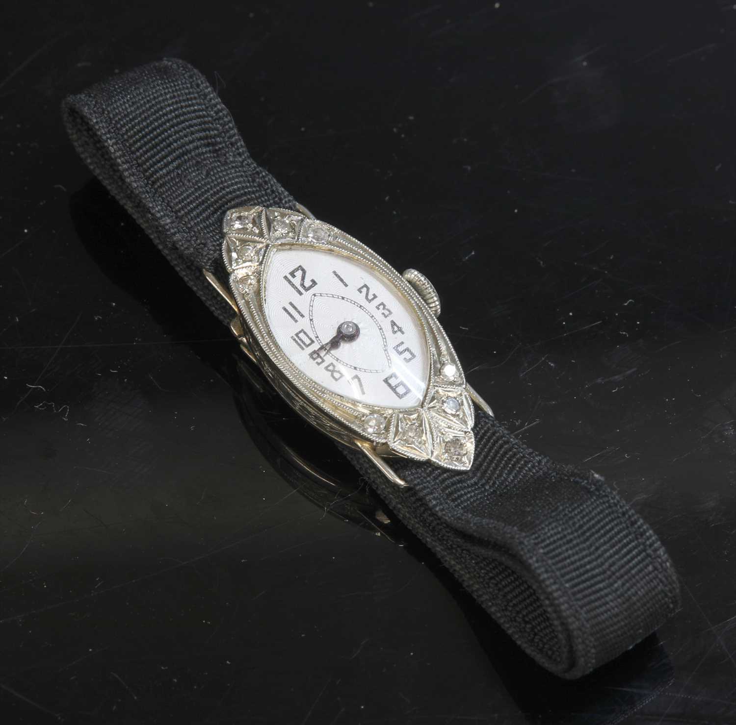 Lot 116 - A ladies' 18ct white gold diamond set cocktail strap watch, c.1928