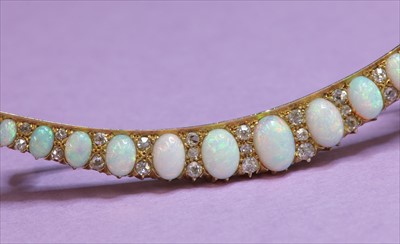 Lot 67 - A late Victorian gold opal and diamond crescent brooch, c.1890