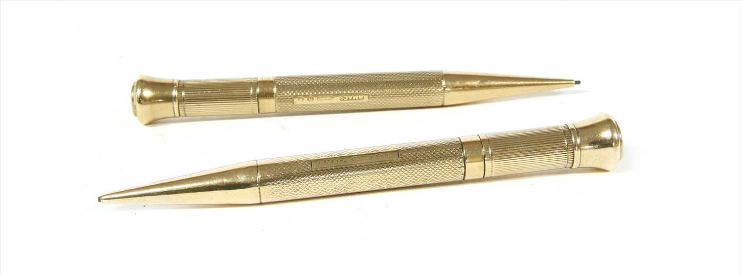 Lot 69 - A pair of 9ct gold propelling pencils