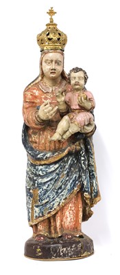 Lot 654 - A carved wooden and polychrome painted figure of the Madonna and Child