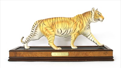 Lot 318 - A collection of four Franklin Mint ceramic model wild cats