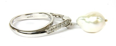 Lot 113 - A white gold cultured baroque pearl and diamond ring