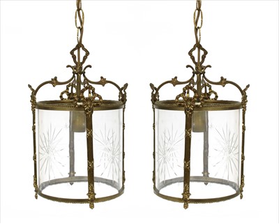 Lot 328 - A pair of glass and gilt metal pendant lights