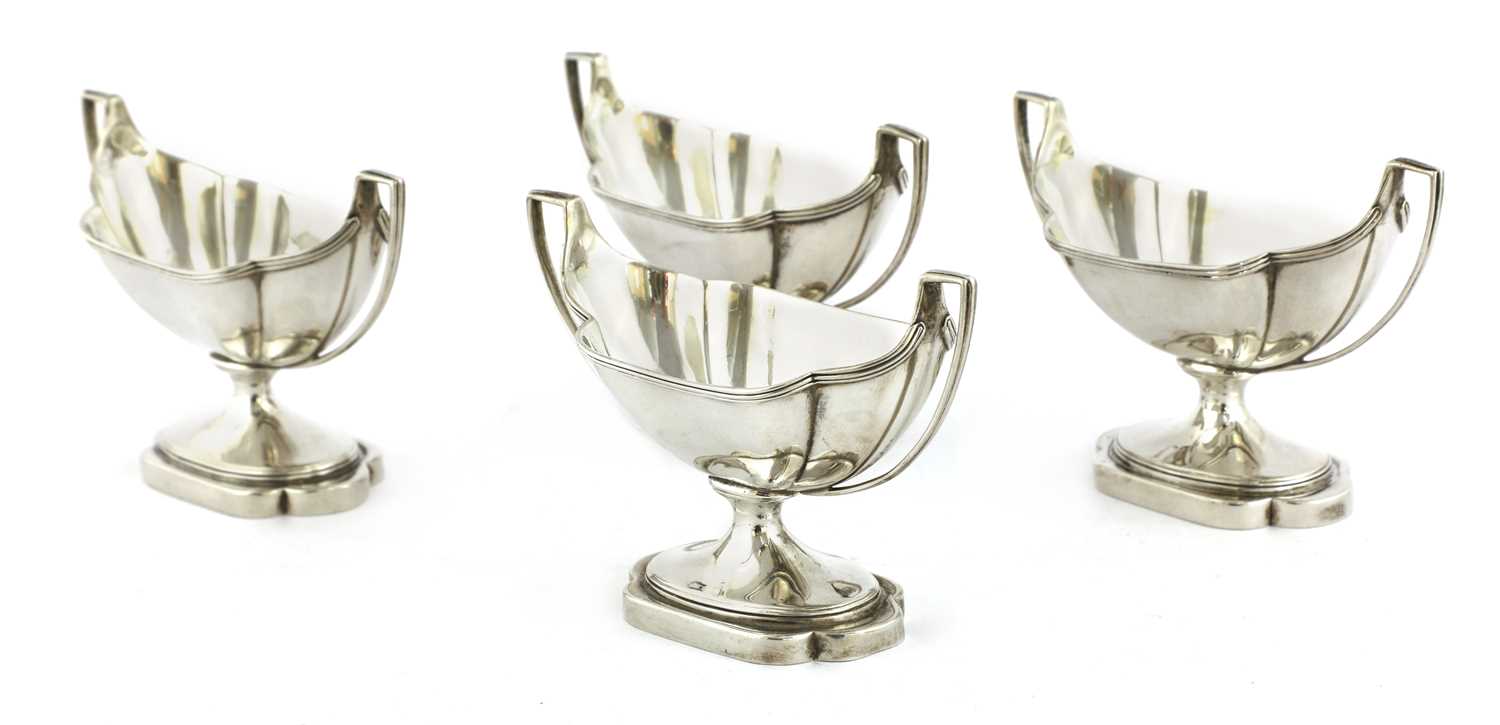 Lot 9 - A set of four George III silver salts
