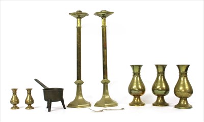 Lot 329 - A pair of tall brass candlesticks