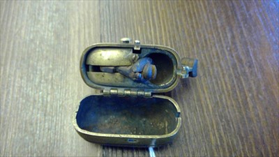 Lot 123 - A Japanese brass tinder lighter
