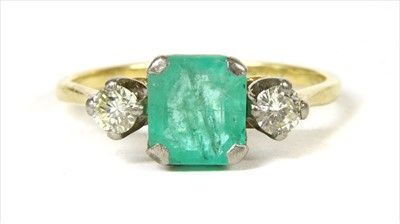 Lot 42 - A gold emerald and diamond three stone ring