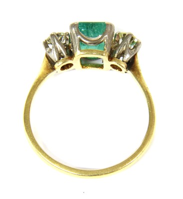 Lot 42 - A gold emerald and diamond three stone ring