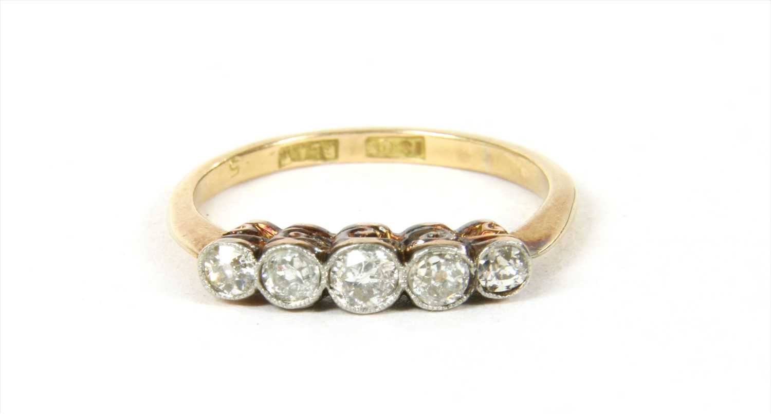 Lot 9 - A gold five stone diamond ring