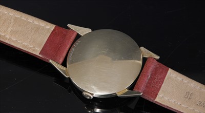Lot 370 - A gentlemen's gold Wittnauer 'Revue' mechanical strap watch, c.1955-1965