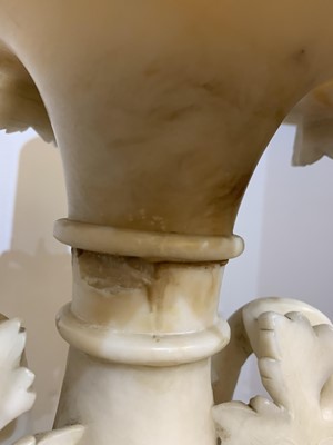 Lot 520 - A pair of alabaster candle stands