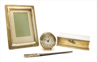 Lot 103 - A silver cased travelling alarm clock