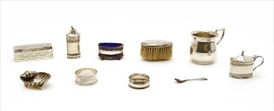 Lot 106 - A silver three piece cruet set with pierced decoration