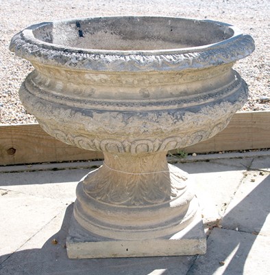 Lot 124 - A reconstituted stone urn shaped planter