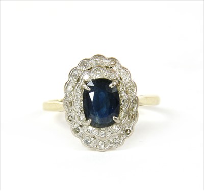 Lot 32 - A gold sapphire and diamond cluster ring
