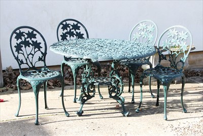 Lot 625 - A Victorian design green painted wrought iron garden suite