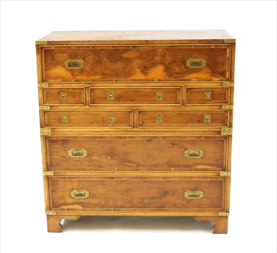 Lot 521 - A yew wood campaign design two section secretaire chest