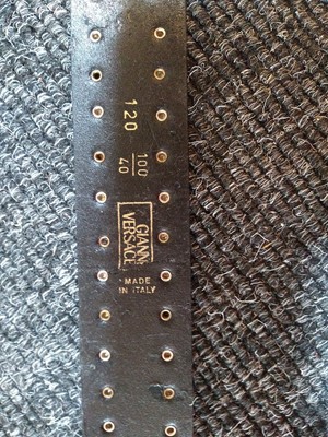Lot 1139 - A Versace black medusa belt