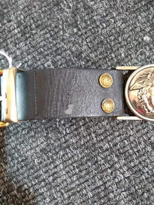 Lot 1139 - A Versace black medusa belt
