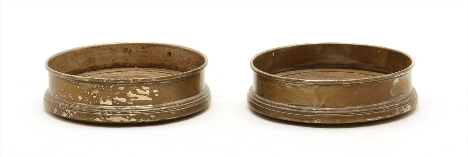 Lot 191 - A pair of silver bottle coasters