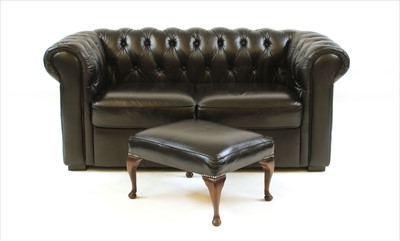 Lot 622 - A black leather two seater Chesterfield sofa