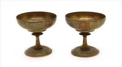 Lot 237 - A pair of low gilded brass urns