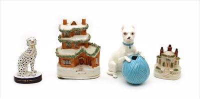 Lot 254 - A Minton style porcelain dog with a ball of wool