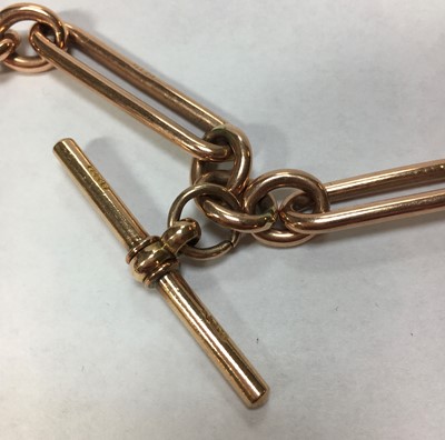Lot 180 - A 9ct rose gold fetter link double Albert chain