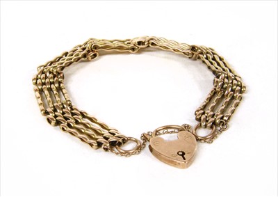 Lot 5 - A gold four row gate bracelet