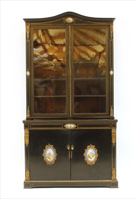Lot 509 - An early 19th century brass inlaid cabinet bookcase