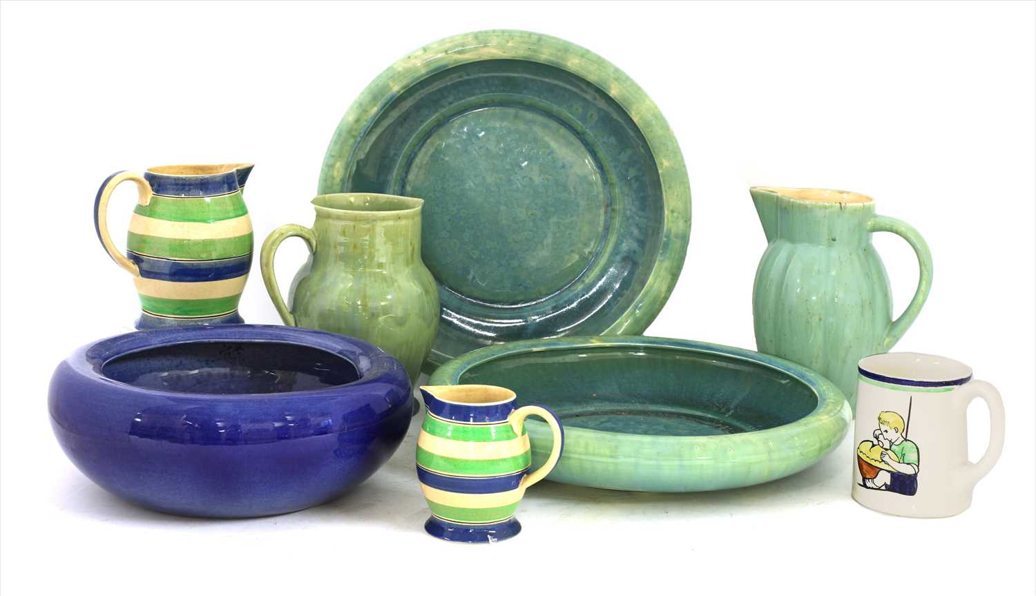 Lot 411 - Five Ashtead Potters' jugs and a mug